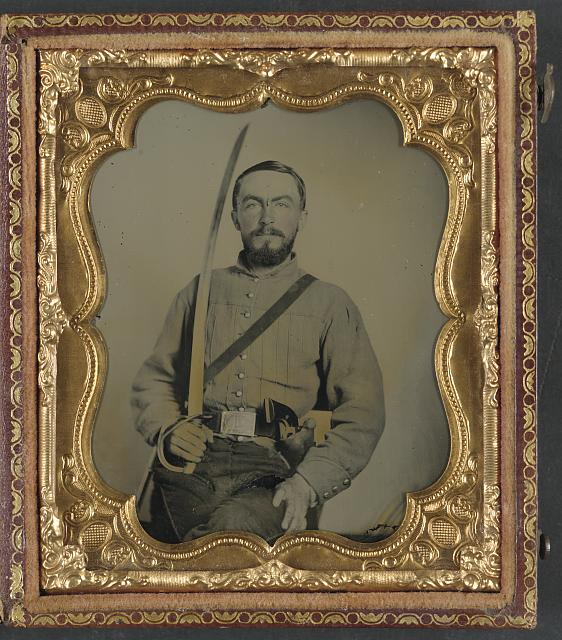 Confederate Cavalryman with revolver and saber.jpg