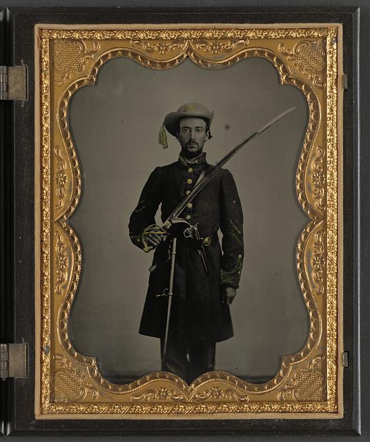 Confederate trooper with sword and revolver.jpg